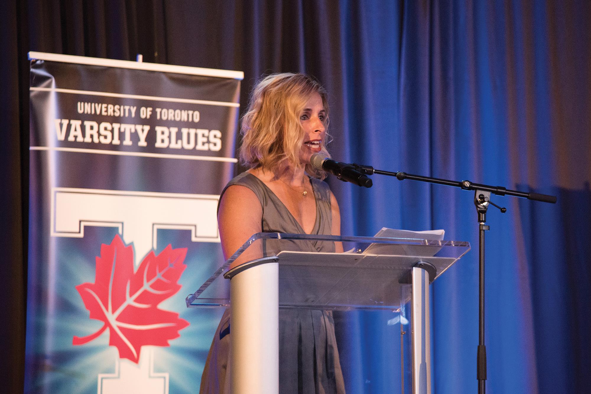 Challoner speaking at a Toronto Varsity Blues event. Photo courtesy Mary Beth Challoner.